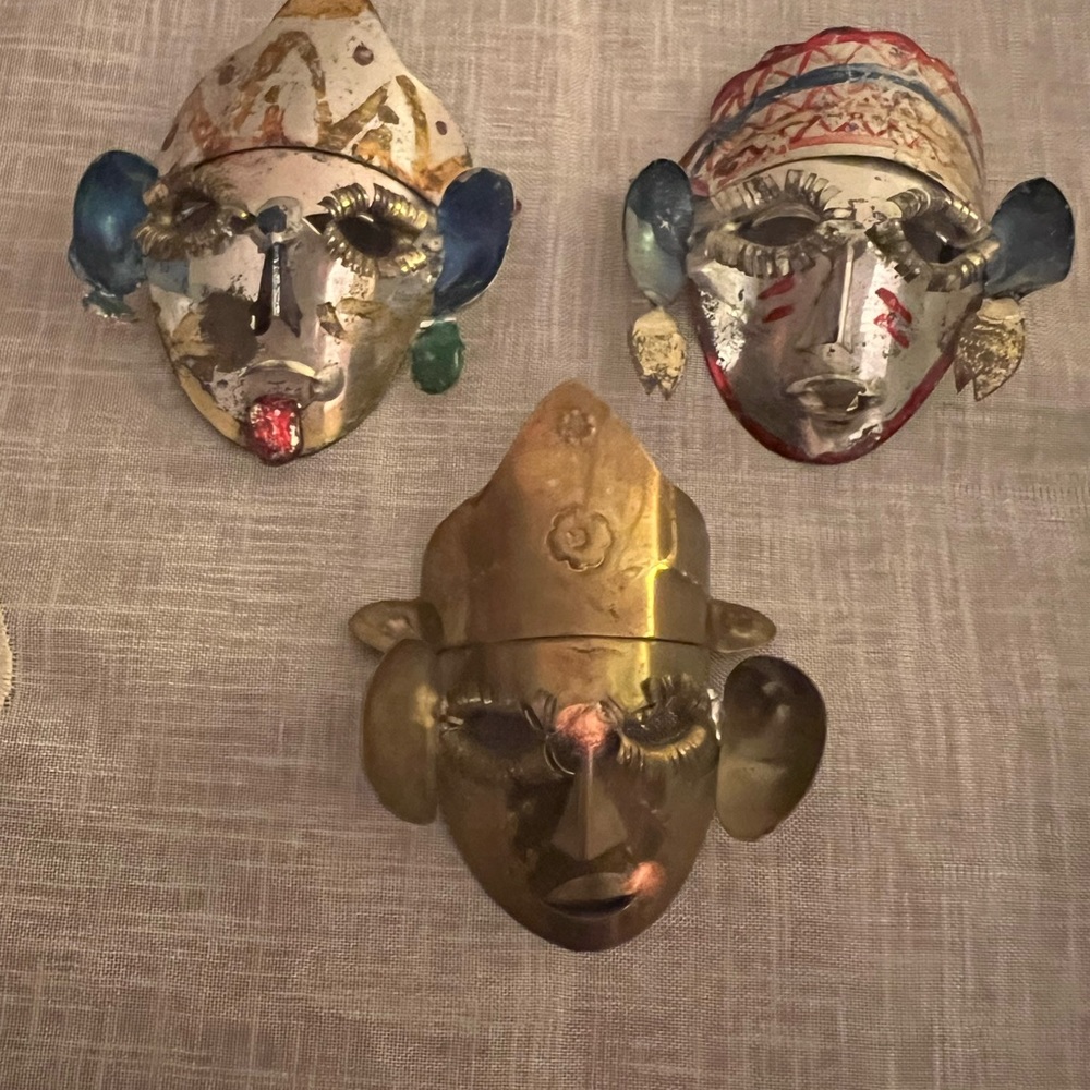 Three hand made tribal mask pins brooches brass and aluminum